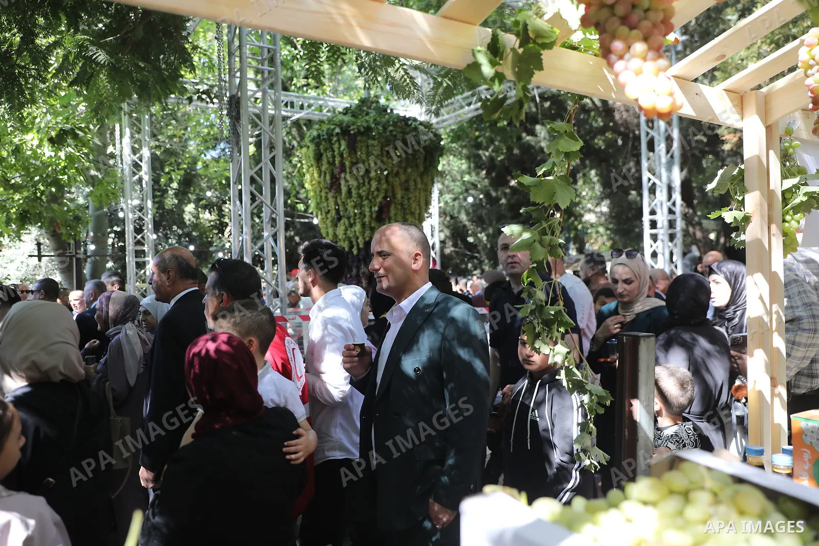 Palestinian farmers and residents take part in a grape festival in the Old City of Hebron, West Bank, on September 26, 2026, celebrating the grape harvest for which the area is known. The festival featured various grape...