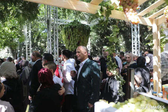 Palestinian farmers and residents take part in a grape festival in the Old City of Hebron, West Bank, on September 26, 2026, celebrating the grape harvest for which the area is known. The festival featured various grape...