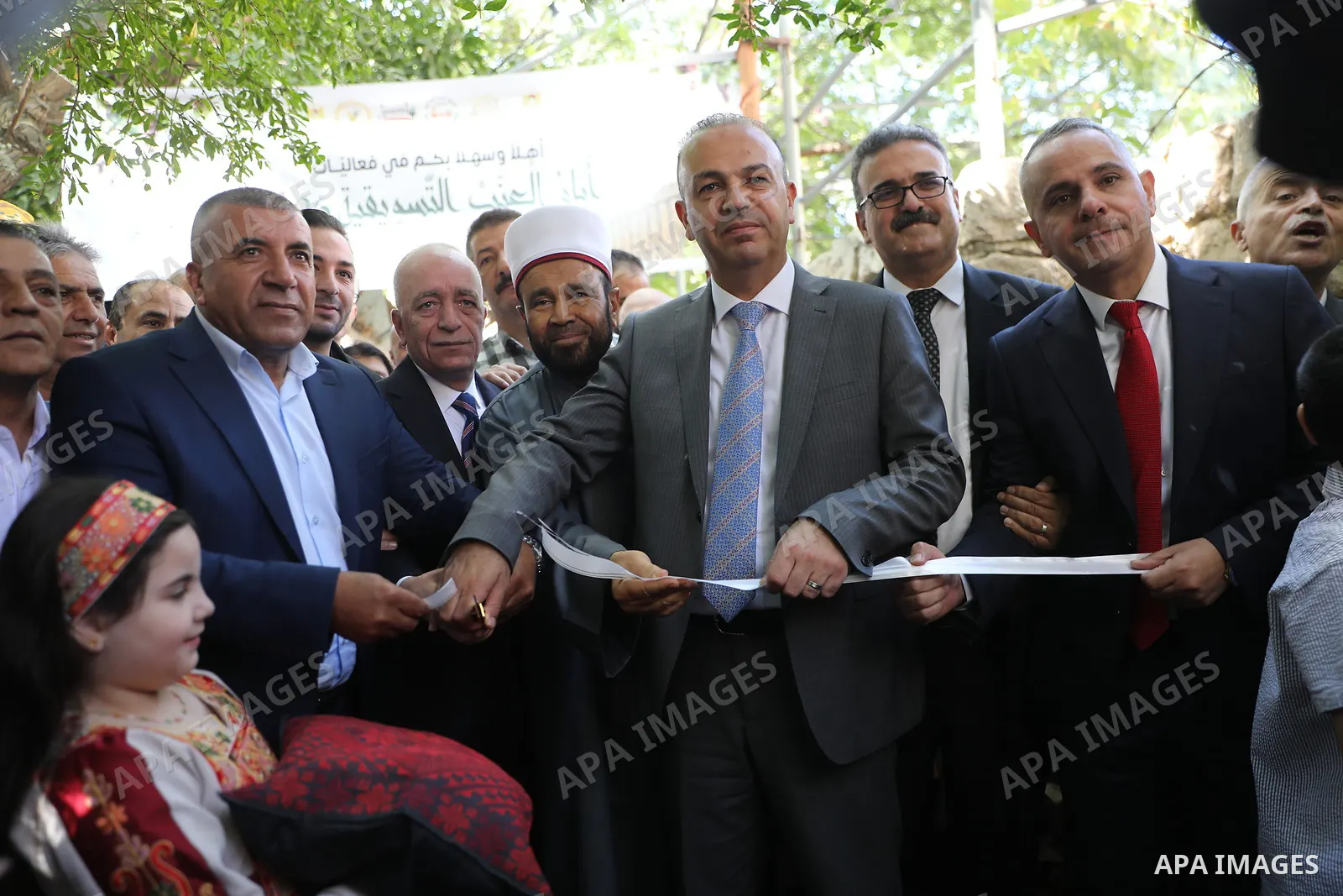 Palestinian farmers and residents take part in a grape festival in the Old City of Hebron, West Bank, on September 26, 2026, celebrating the grape harvest for which the area is known. The festival featured various grape...