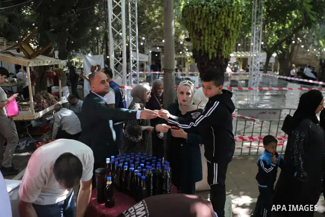 Palestinian farmers and residents take part in a grape festival in the Old City of Hebron, West Bank, on September 26, 2026, celebrating the grape harvest for which the area is known. The festival featured various grape...