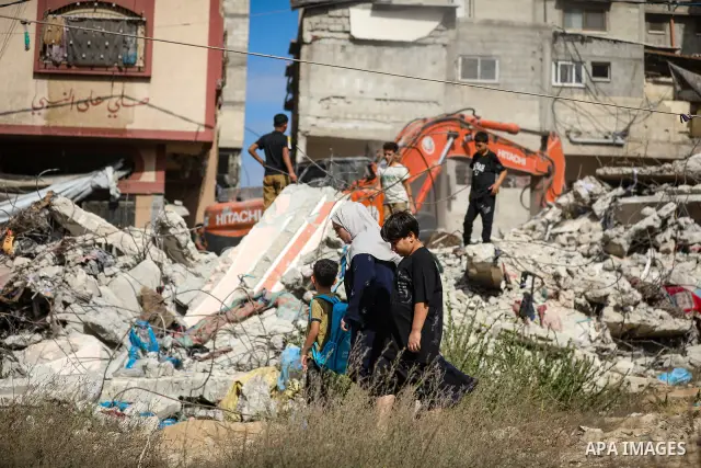 Civil Defense crews recover the bodies of Palestinians from beneath the rubble of a house belonging to the Attallah family, which was destroyed in an Israeli strike during the war, in Gaza City on September 26, 2026. Res...