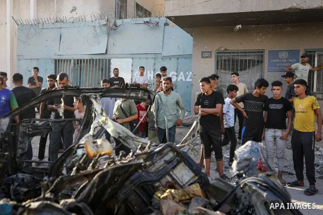 Palestinians gather at the site of an Israeli airstrike that targeted a vehicle near al-Sinaa junction in Gaza City on September 27, 2026. The strike killed one Palestinian and wounded others, according to local sources....