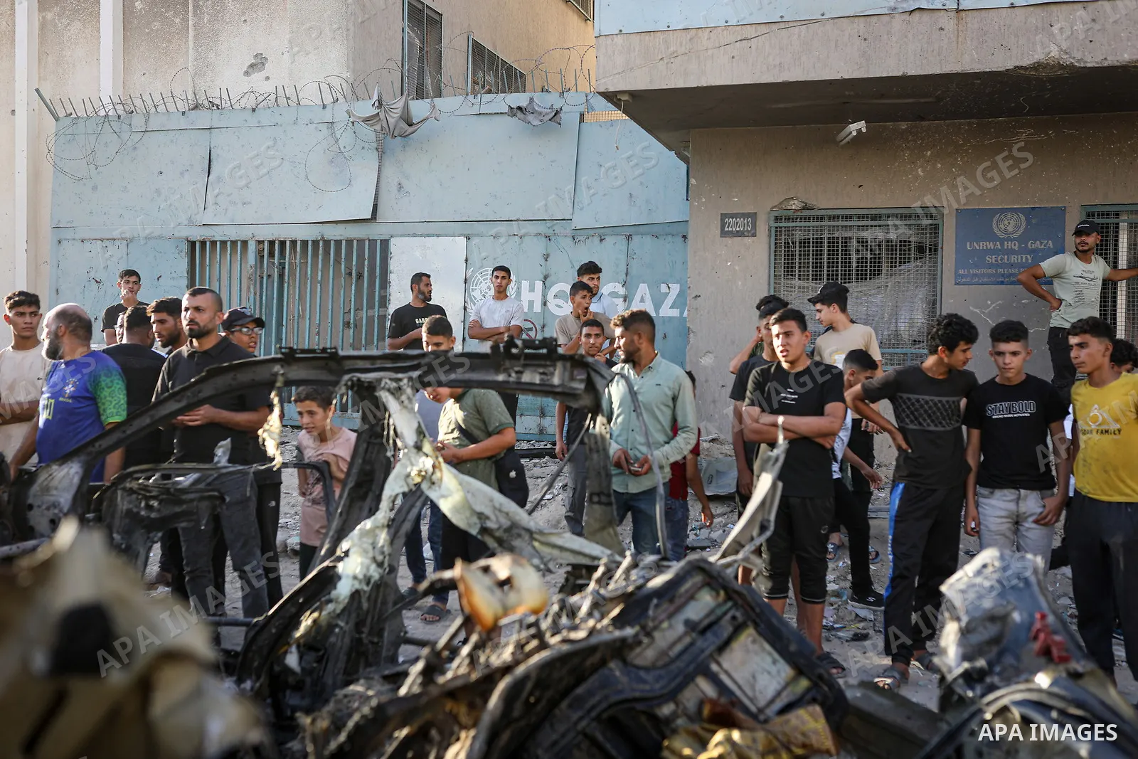 Palestinians gather at the site of an Israeli airstrike that targeted a vehicle near al-Sinaa junction in Gaza City on September 27, 2026. The strike killed one Palestinian and wounded others, according to local sources....