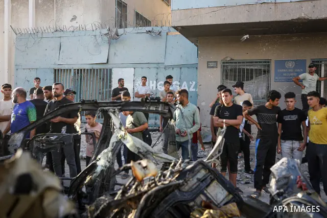 Palestinians gather at the site of an Israeli airstrike that targeted a vehicle near al-Sinaa junction in Gaza City on September 27, 2026. The strike killed one Palestinian and wounded others, according to local sources....