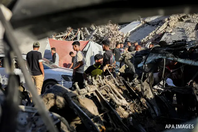 Palestinians gather at the site of an Israeli airstrike that targeted a vehicle near al-Sinaa junction in Gaza City on September 27, 2026. The strike killed one Palestinian and wounded others, according to local sources....