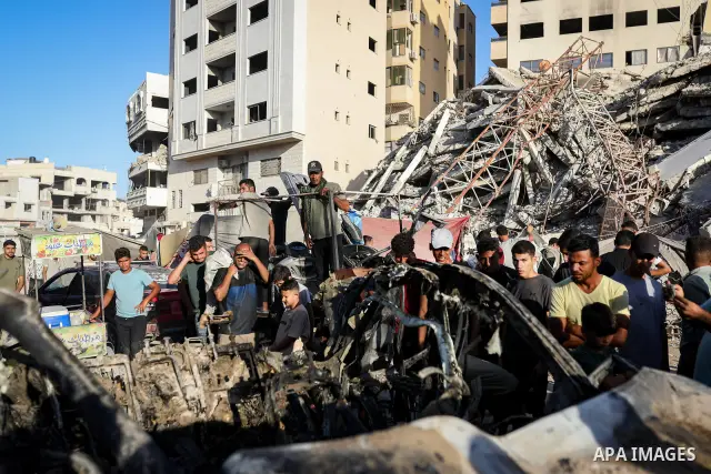 Palestinians gather at the site of an Israeli airstrike that targeted a vehicle near al-Sinaa junction in Gaza City on September 27, 2026. The strike killed one Palestinian and wounded others, according to local sources....