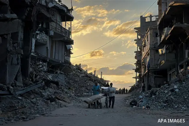 Displaced Palestinians continue their daily lives among destroyed buildings in Jabalia, northern Gaza Strip, on September 27, 2026, amid widespread destruction caused by the war and a severe housing crisis that limits fa...