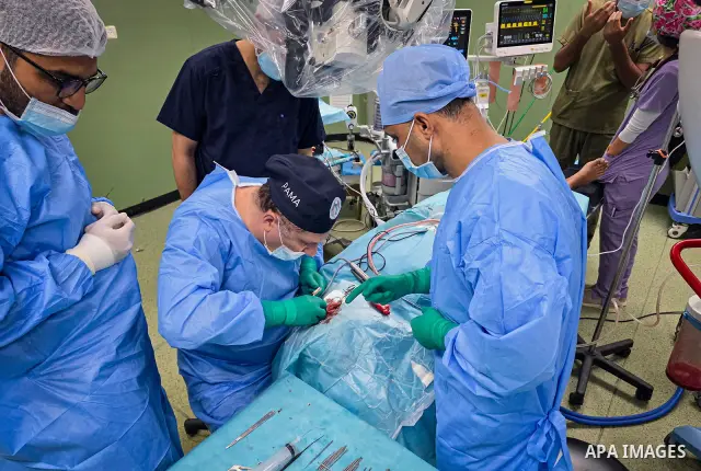 A medical team performs cochlear implant surgery on a child at Nasser Medical Complex in Khan Younis, southern Gaza Strip, on September 27, 2026. The operation is part of a project to provide similar surgeries for 50 chi...