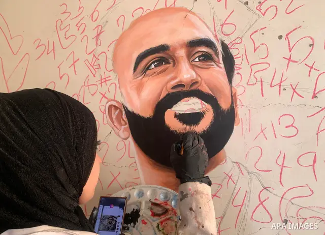 Palestinian artist Aseel Nasman creates artwork on the rubble of destroyed homes in the Gaza Strip on September 24, 2026. Nasman uses her art to portray international figures who have expressed support for Palestinians,...