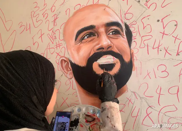 Palestinian artist Aseel Nasman creates artwork on the rubble of destroyed homes in the Gaza Strip on September 24, 2026. Nasman uses her art to portray international figures who have expressed support for Palestinians,...