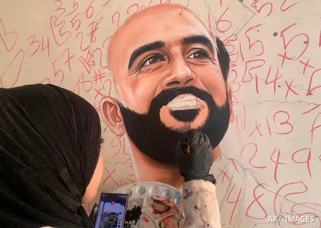 Palestinian artist Aseel Nasman creates artwork on the rubble of destroyed homes in the Gaza Strip on September 24, 2026. Nasman uses her art to portray international figures who have expressed support for Palestinians,...