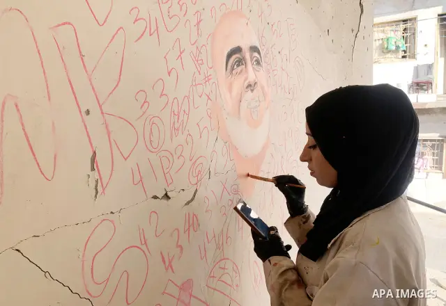 Palestinian artist Aseel Nasman creates artwork on the rubble of destroyed homes in the Gaza Strip on September 24, 2026. Nasman uses her art to portray international figures who have expressed support for Palestinians,...