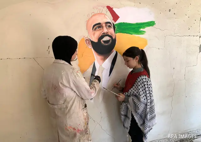 Palestinian artist Aseel Nasman creates artwork on the rubble of destroyed homes in the Gaza Strip on September 24, 2026. Nasman uses her art to portray international figures who have expressed support for Palestinians,...