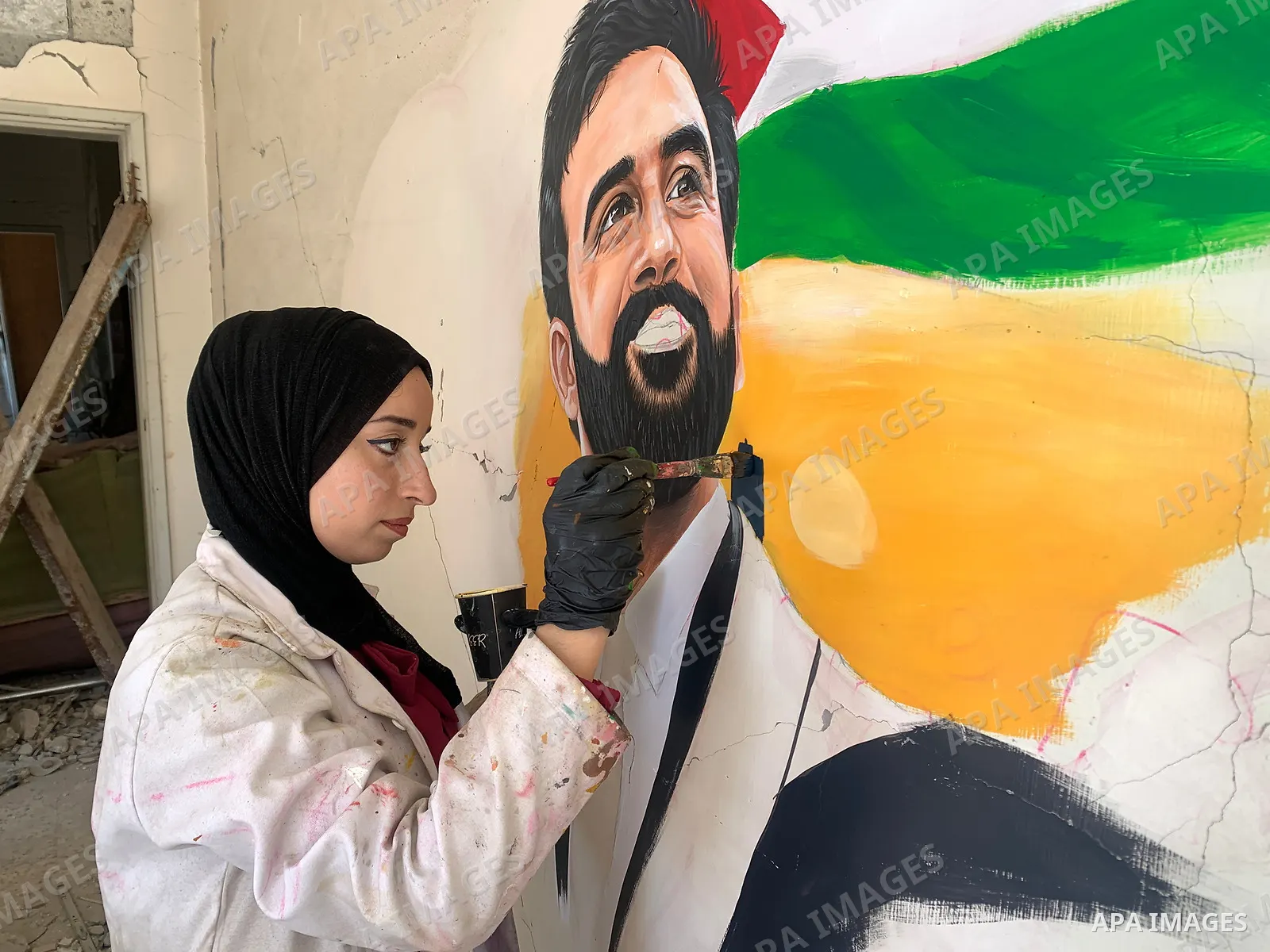 Palestinian artist Aseel Nasman creates artwork on the rubble of destroyed homes in the Gaza Strip on September 24, 2026. Nasman uses her art to portray international figures who have expressed support for Palestinians,...