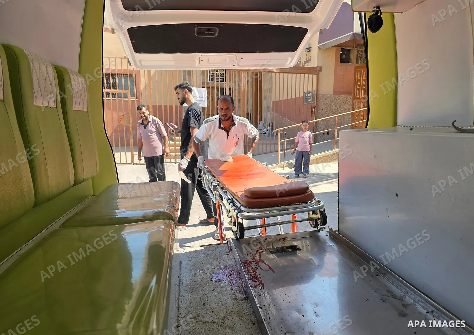 The body of Mohammed Kamel Mohsen al-Raqab is brought to Nasser Medical Complex after being recovered following an Israeli strike that targeted a group of Palestinians on Roni Street in the al-Mawasi area of Khan Younis,...