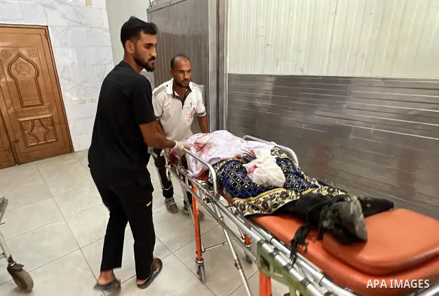 The body of Mohammed Kamel Mohsen al-Raqab is brought to Nasser Medical Complex after being recovered following an Israeli strike that targeted a group of Palestinians on Roni Street in the al-Mawasi area of Khan Younis,...