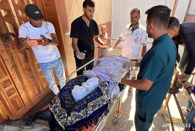 The body of Mohammed Kamel Mohsen al-Raqab is brought to Nasser Medical Complex after being recovered following an Israeli strike that targeted a group of Palestinians on Roni Street in the al-Mawasi area of Khan Younis,...