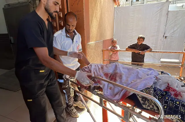 The body of Mohammed Kamel Mohsen al-Raqab is brought to Nasser Medical Complex after being recovered following an Israeli strike that targeted a group of Palestinians on Roni Street in the al-Mawasi area of Khan Younis,...