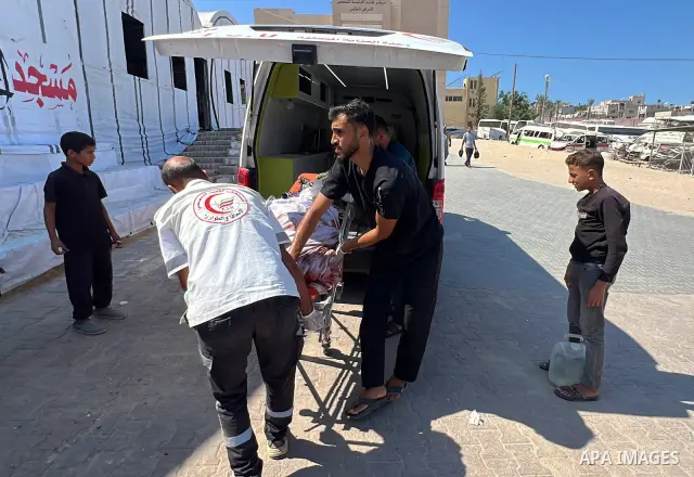 The body of Mohammed Kamel Mohsen al-Raqab is brought to Nasser Medical Complex after being recovered following an Israeli strike that targeted a group of Palestinians on Roni Street in the al-Mawasi area of Khan Younis,...