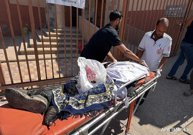 The body of Mohammed Kamel Mohsen al-Raqab is brought to Nasser Medical Complex after being recovered following an Israeli strike that targeted a group of Palestinians on Roni Street in the al-Mawasi area of Khan Younis,...