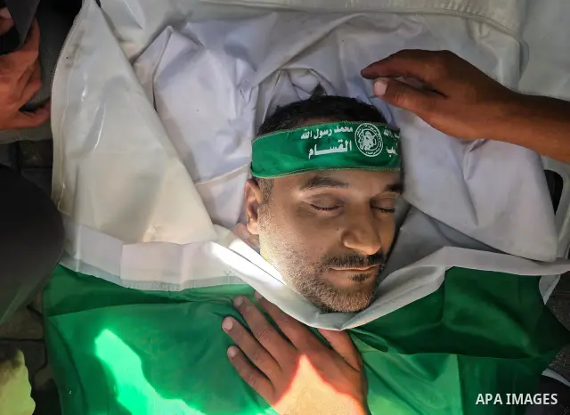 CAPTION: Palestinians mourn and attend the funeral of Hassan al-Batta, 42, who died from wounds sustained in an Israeli airstrike that targeted him in central Khan Younis, in the southern Gaza Strip, on September 25, 202...
