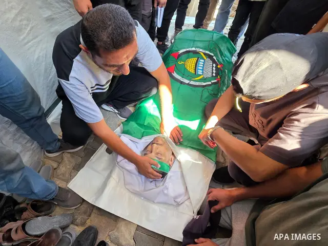 CAPTION: Palestinians mourn and attend the funeral of Hassan al-Batta, 42, who died from wounds sustained in an Israeli airstrike that targeted him in central Khan Younis, in the southern Gaza Strip, on September 25, 202...