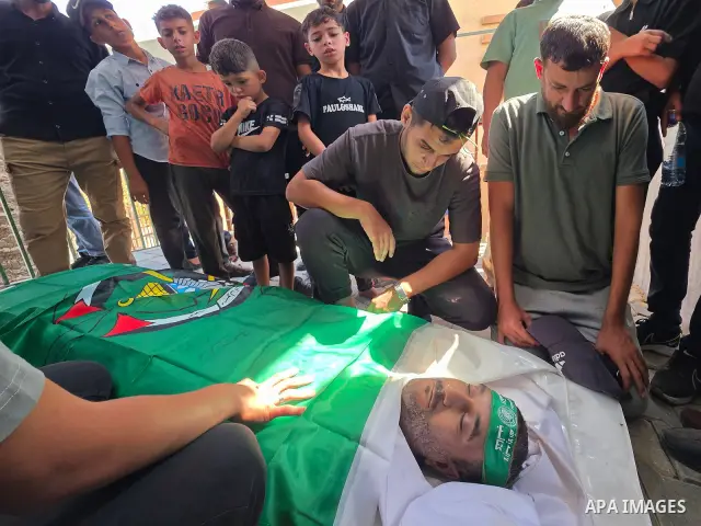 CAPTION: Palestinians mourn and attend the funeral of Hassan al-Batta, 42, who died from wounds sustained in an Israeli airstrike that targeted him in central Khan Younis, in the southern Gaza Strip, on September 25, 202...