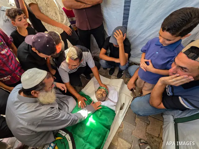 CAPTION: Palestinians mourn and attend the funeral of Hassan al-Batta, 42, who died from wounds sustained in an Israeli airstrike that targeted him in central Khan Younis, in the southern Gaza Strip, on September 25, 202...