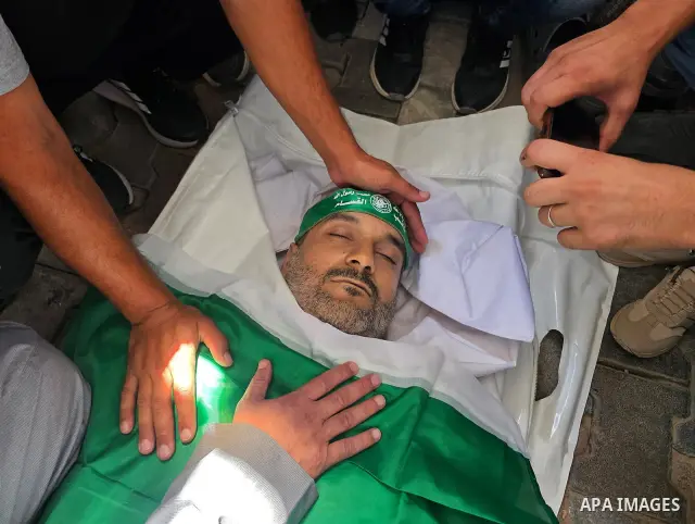 CAPTION: Palestinians mourn and attend the funeral of Hassan al-Batta, 42, who died from wounds sustained in an Israeli airstrike that targeted him in central Khan Younis, in the southern Gaza Strip, on September 25, 202...