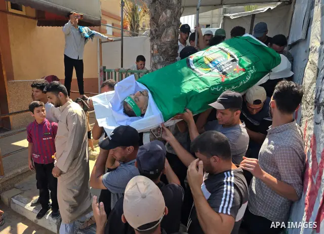 CAPTION: Palestinians mourn and attend the funeral of Hassan al-Batta, 42, who died from wounds sustained in an Israeli airstrike that targeted him in central Khan Younis, in the southern Gaza Strip, on September 25, 202...