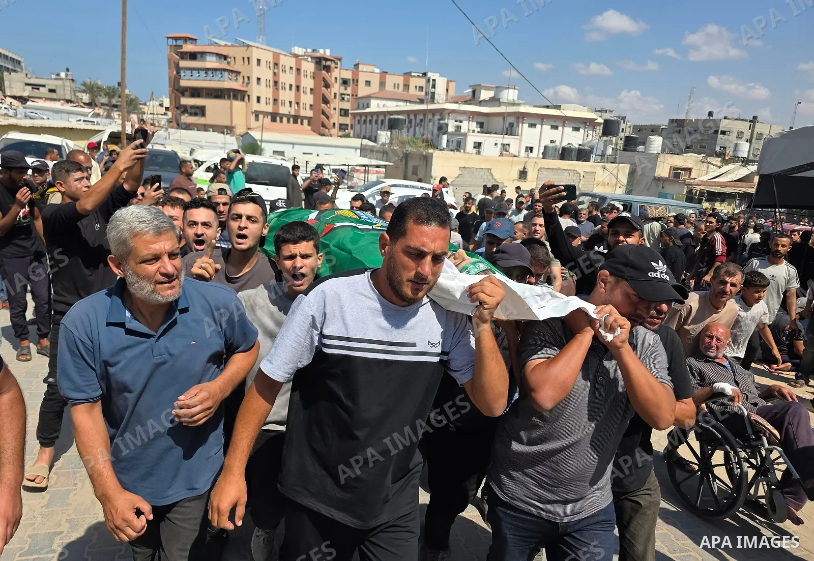 CAPTION: Palestinians mourn and attend the funeral of Hassan al-Batta, 42, who died from wounds sustained in an Israeli airstrike that targeted him in central Khan Younis, in the southern Gaza Strip, on September 25, 202...