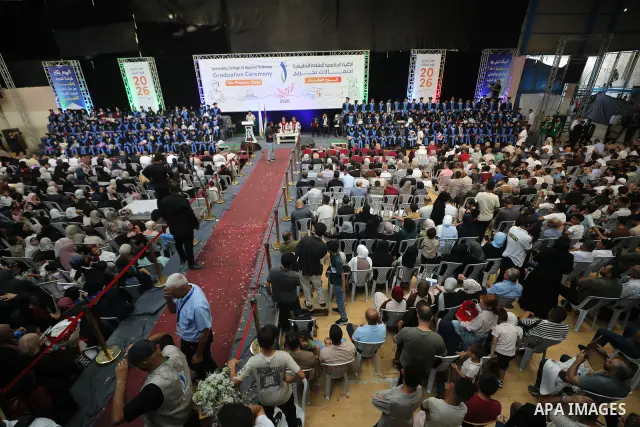 Palestinian students take part in a graduation ceremony for the University College of Applied Sciences at the Nuseirat refugee camp in the central Gaza Strip on September 24, 2026. The ceremony brought together graduates...