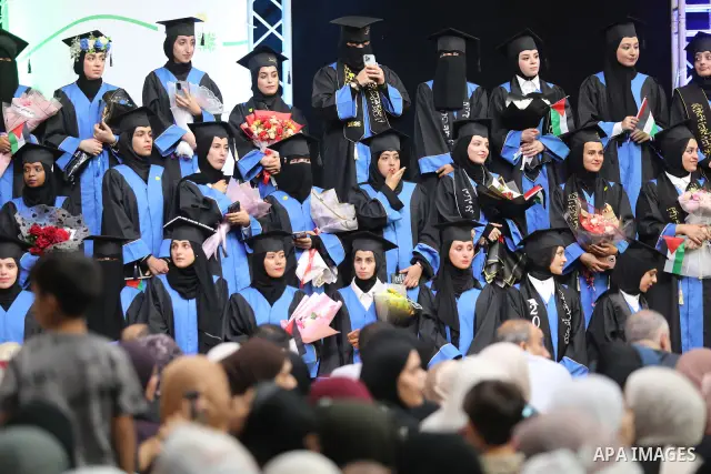 Palestinian students take part in a graduation ceremony for the University College of Applied Sciences at the Nuseirat refugee camp in the central Gaza Strip on September 24, 2026. The ceremony brought together graduates...