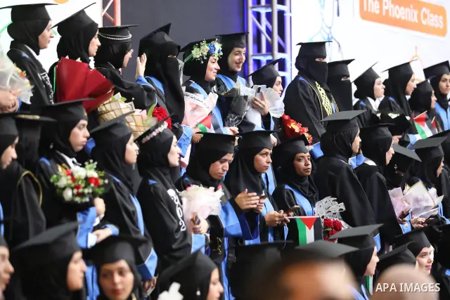 Palestinian students take part in a graduation ceremony for the University College of Applied Sciences at the Nuseirat refugee camp in the central Gaza Strip on September 24, 2026. The ceremony brought together graduates...