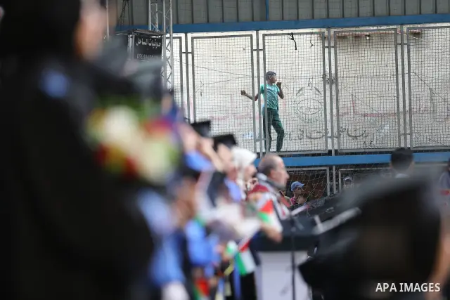 Palestinian students take part in a graduation ceremony for the University College of Applied Sciences at the Nuseirat refugee camp in the central Gaza Strip on September 24, 2026. The ceremony brought together graduates...