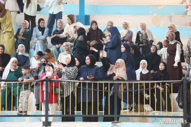 Palestinian students take part in a graduation ceremony for the University College of Applied Sciences at the Nuseirat refugee camp in the central Gaza Strip on September 24, 2026. The ceremony brought together graduates...