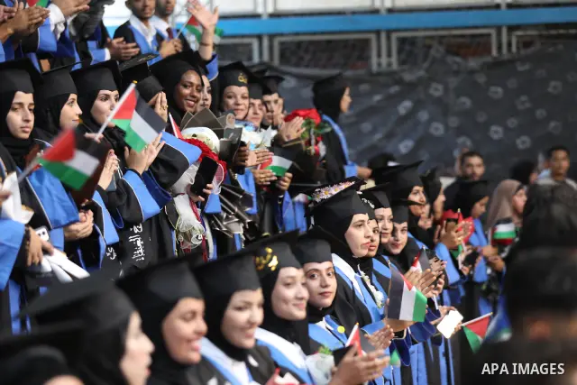 Palestinian students take part in a graduation ceremony for the University College of Applied Sciences at the Nuseirat refugee camp in the central Gaza Strip on September 24, 2026. The ceremony brought together graduates...
