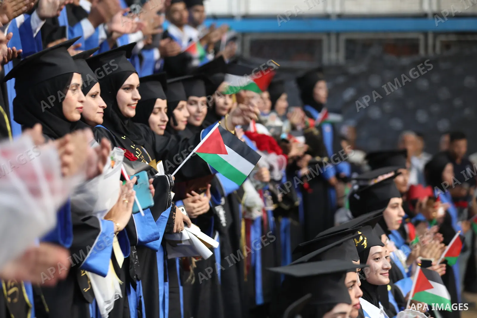 Palestinian students take part in a graduation ceremony for the University College of Applied Sciences at the Nuseirat refugee camp in the central Gaza Strip on September 24, 2026. The ceremony brought together graduates...